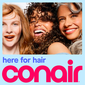 Conair Travel Hair Dryer in use, styling hair