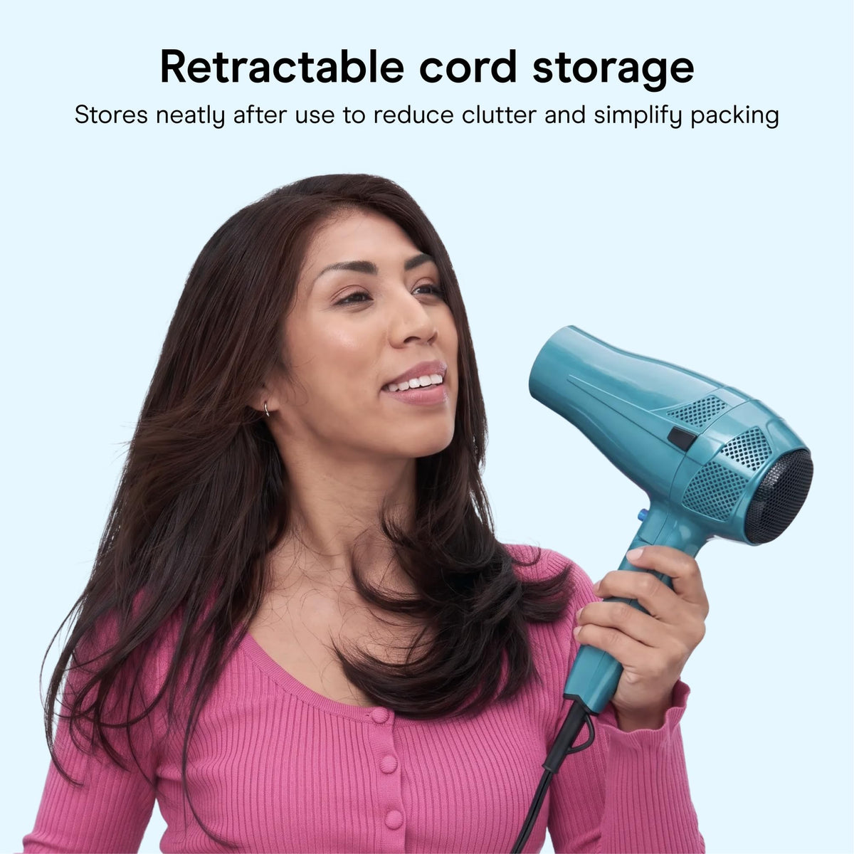 Conair Travel Hair Dryer with compact design next to suitcase