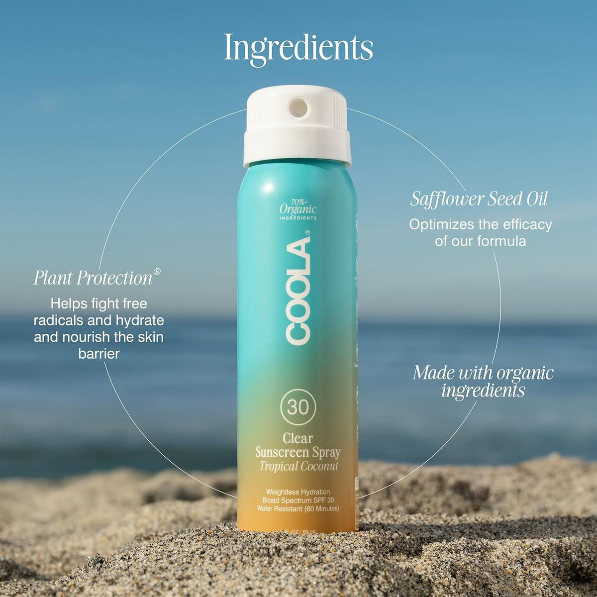 COOLA Clear Sunscreen Spray SPF 30 in hand, ready to apply