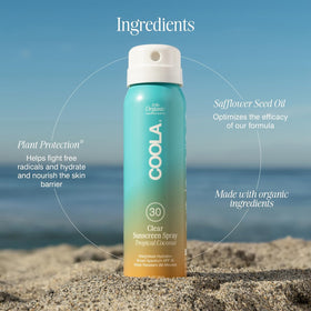COOLA Clear Sunscreen Spray SPF 30 in hand, ready to apply