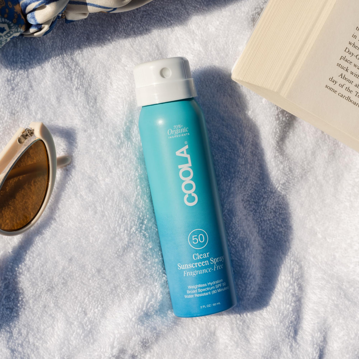 COOLA Clear Sunscreen Spray SPF 50 bottle side view