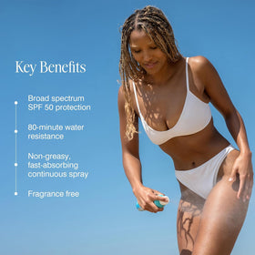 COOLA Clear Sunscreen Spray SPF 50 in outdoor setting