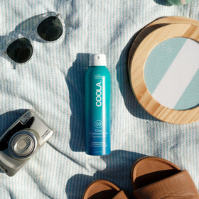 COOLA Clear Sunscreen Spray SPF 50 side view showing nozzle
