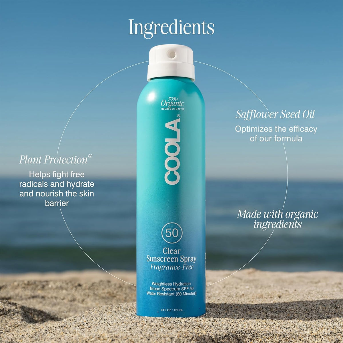 COOLA Clear Sunscreen Spray SPF 50 with beach background