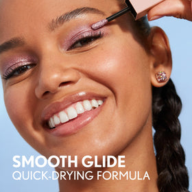 COVERGIRL Exhibitionist Liquid Glitter Eyeshadow alongside other makeup products