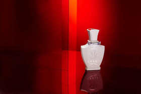 Creed Love in White bottle with floral background