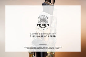 Creed Love in White Eau de Parfum bottle with a scenic view