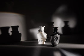 Creed Love in White Eau de Parfum with a soft fabric background
