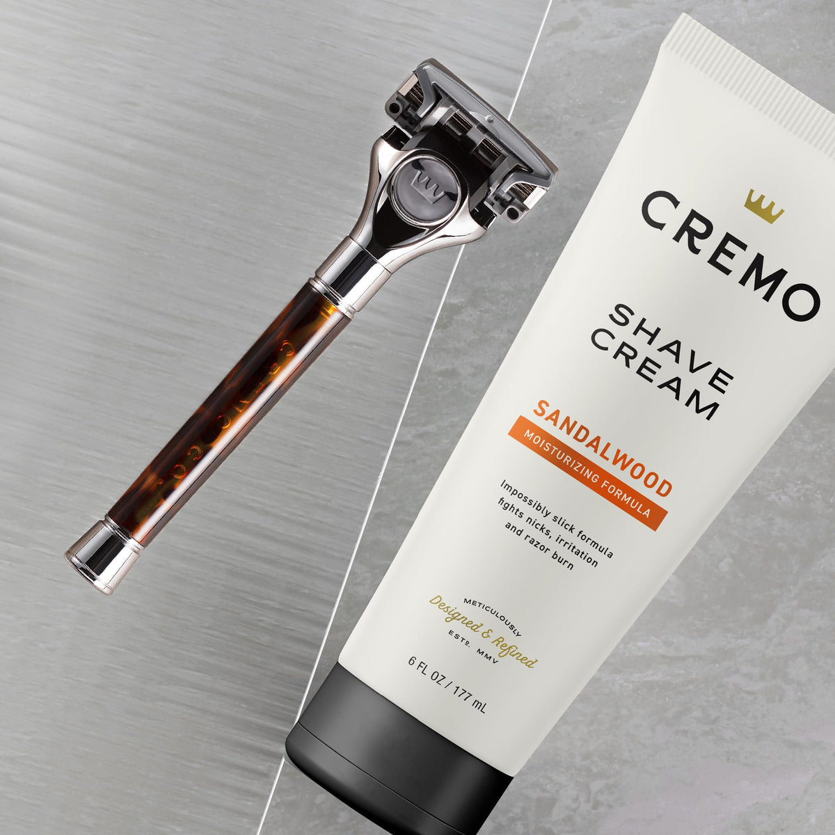 Cremo Sandalwood Shave Cream side view with packaging