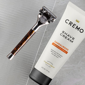 Cremo Sandalwood Shave Cream side view with packaging