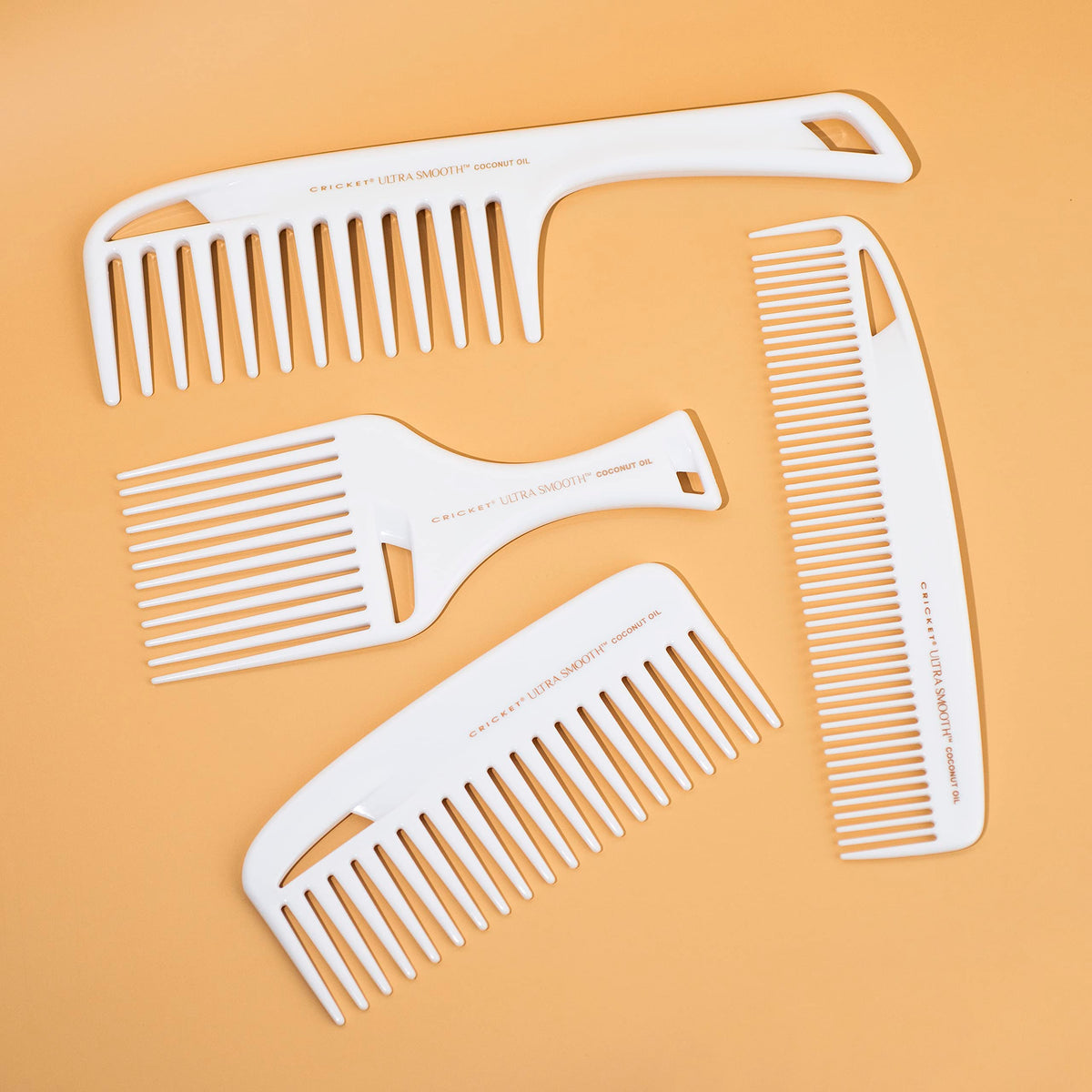 Cricket Ultra Smooth Coconut Dressing Comb in hand for styling