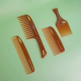 Cricket Ultra Smooth Detangler Comb displayed on a bathroom counter