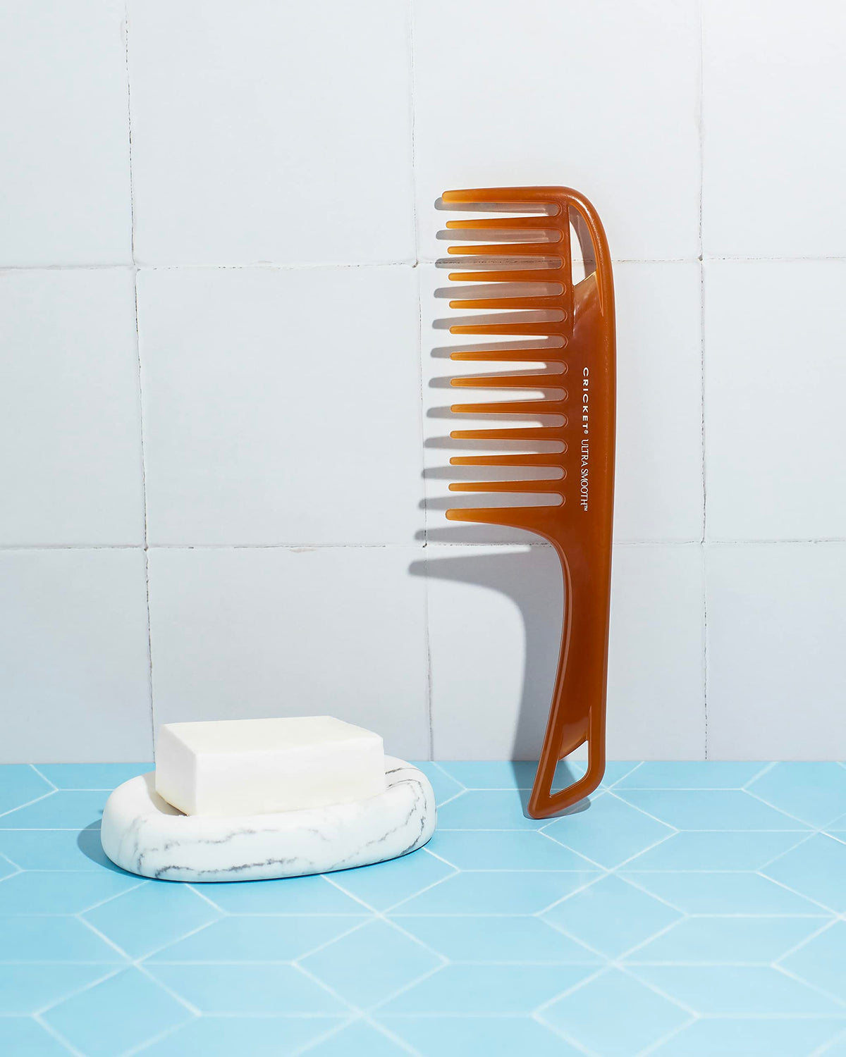 Cricket Ultra Smooth Detangler Comb in use on wet hair