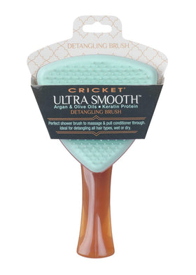 Cricket Ultra Smooth Detangling Brush being used on wet hair