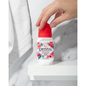 Crystal Essence Pomegranate Deodorant Roll-On application