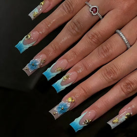 CTTHNBD blue French tip press on nails with flower design front view