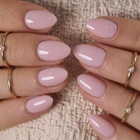 CurvLife Extra Short Almond Press On Nails applied on hands