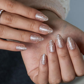 CurvLife Extra Short Almond Press On Nails displayed with nail glue and file