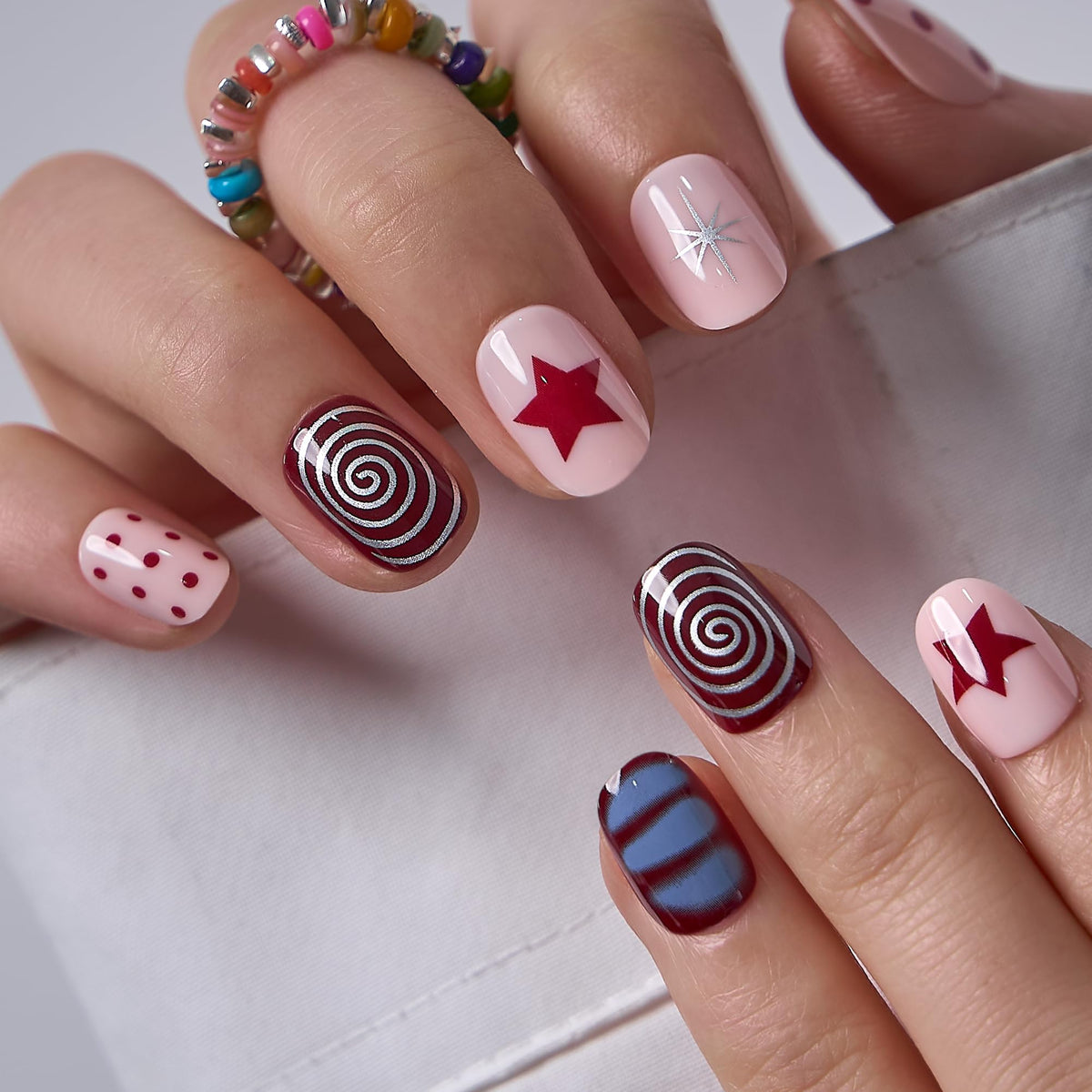 CurvLife Extra Short Square Press On Nails in Red Crimson Swirl front view