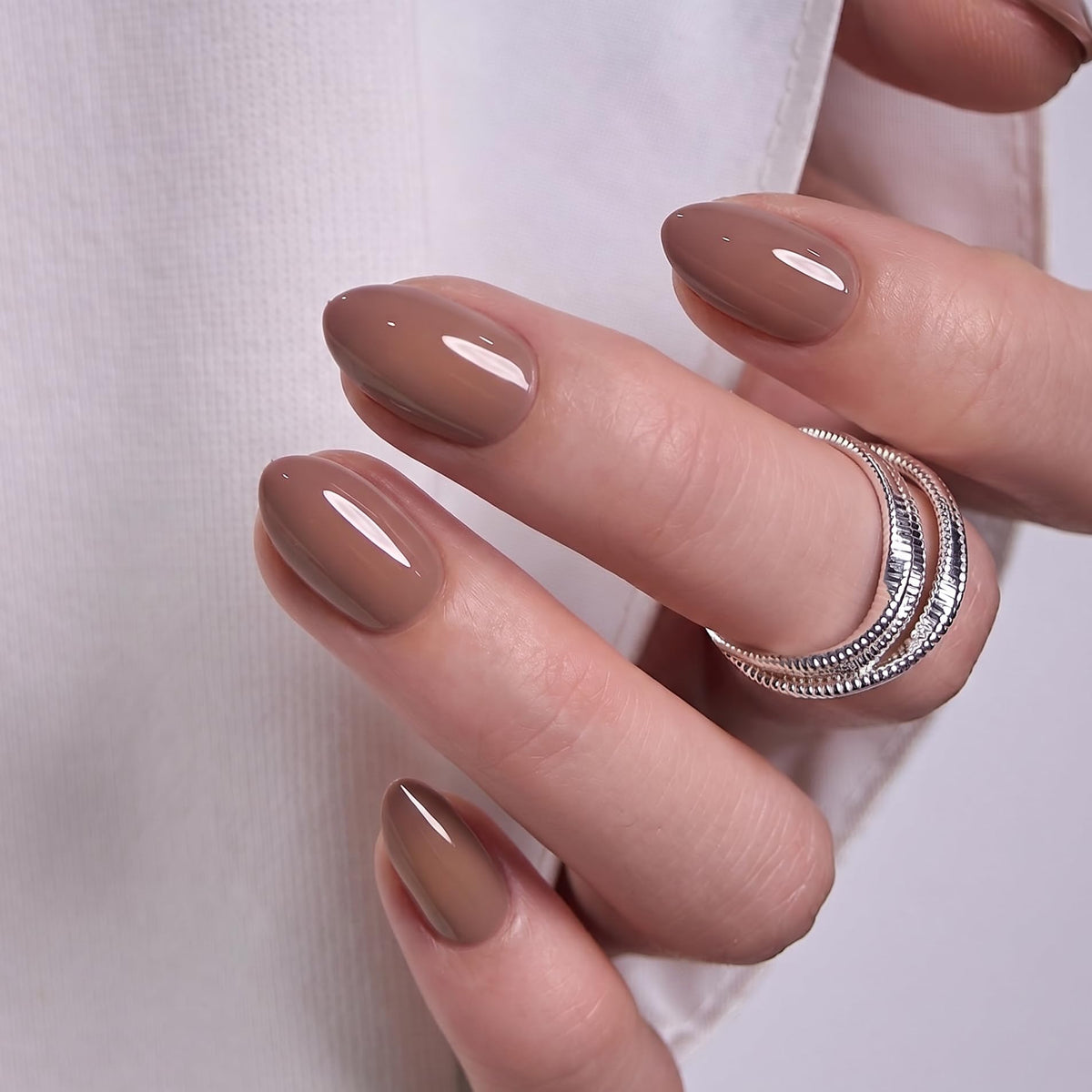 CurvLife Mocha Muse nails with adhesive tabs and nail glue