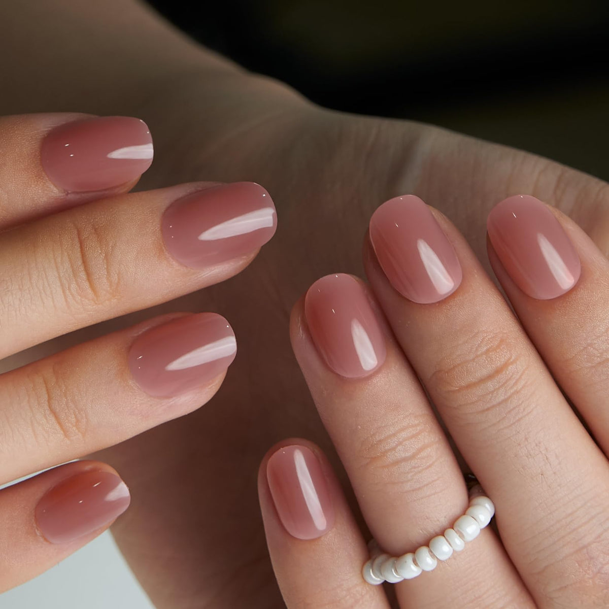CurvLife press on nails displayed with nail glue and adhesive tabs
