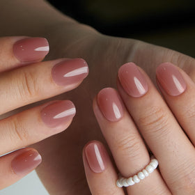 CurvLife press on nails displayed with nail glue and adhesive tabs