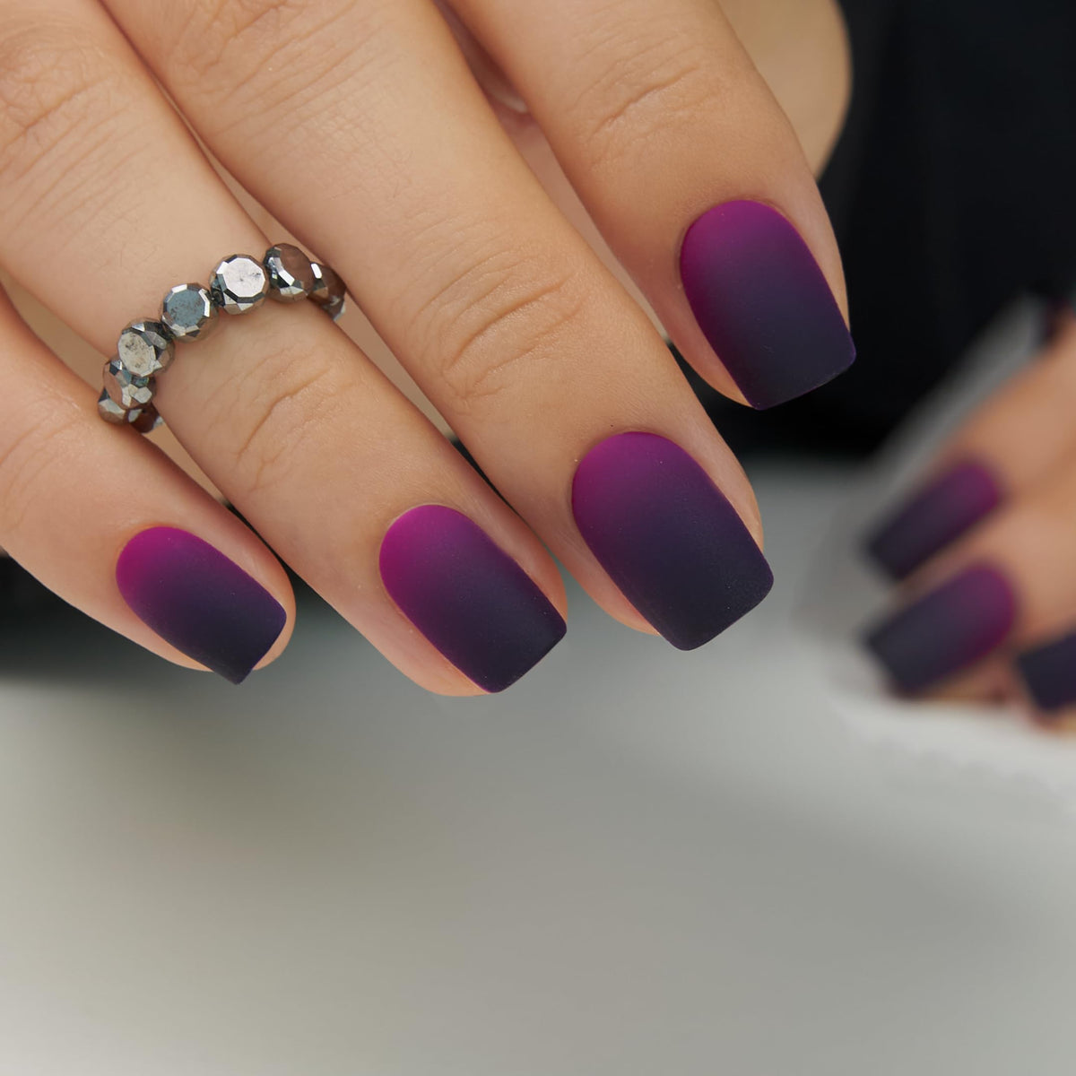 CurvLife press on nails with nail glue and accessories on a table