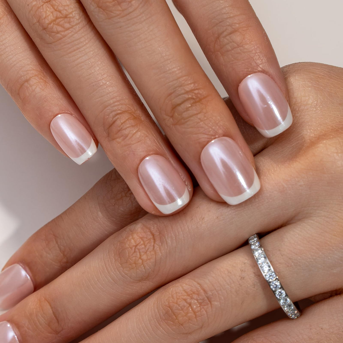 CurvLife Short Square French Tip Press On Nails displayed with a double-sided nail file