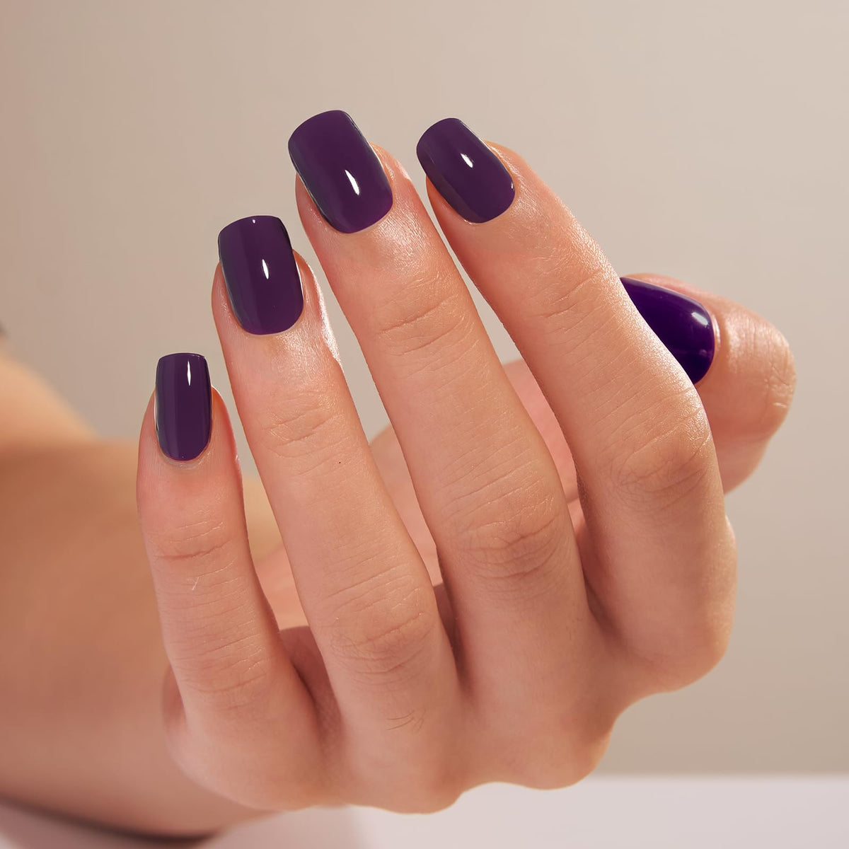 CurvLife Short Square Press On Nails on a hand for a natural look