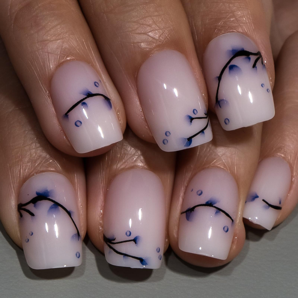 CurvLife Short Square Press On Nails Porcelain Milky White displayed on a hand