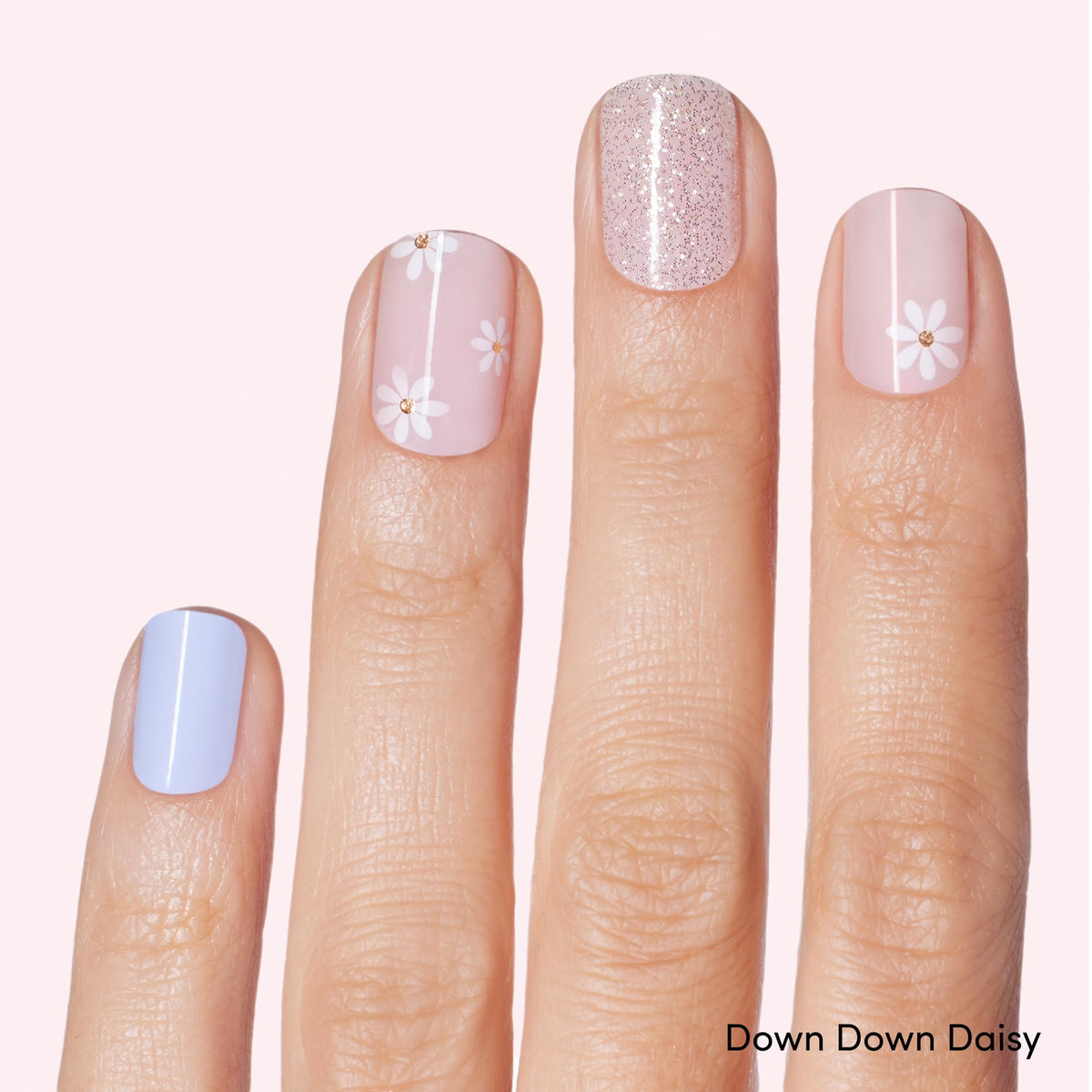 Dashing Diva Down Down Daisy nail strip set showcasing designs