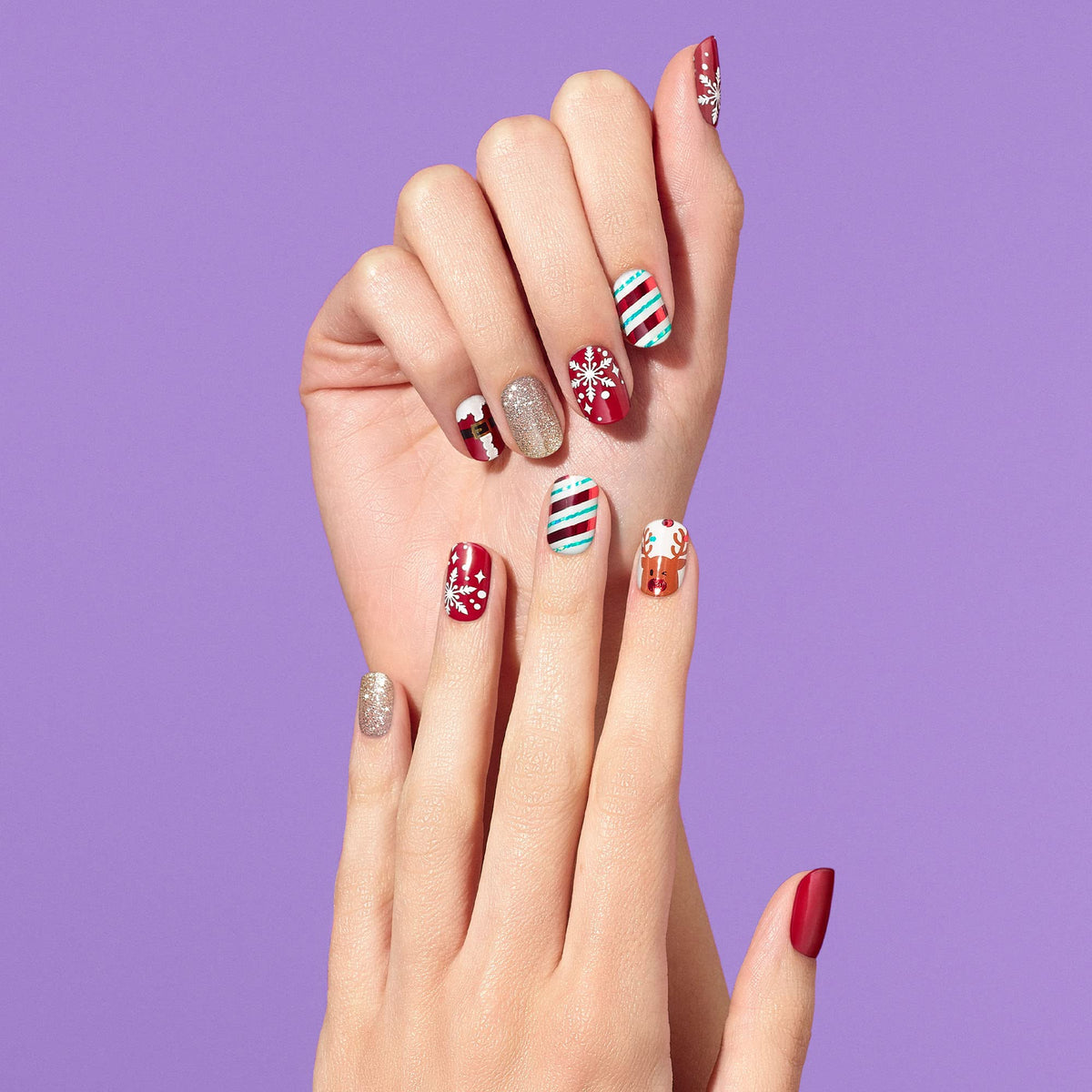 Dashing Diva Santa's Helper nail strips showing reindeer and snowflake patterns