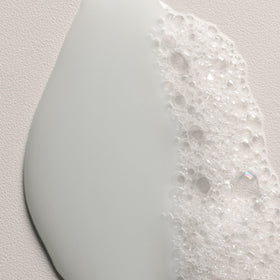 Davines MINU conditioner applied to hair