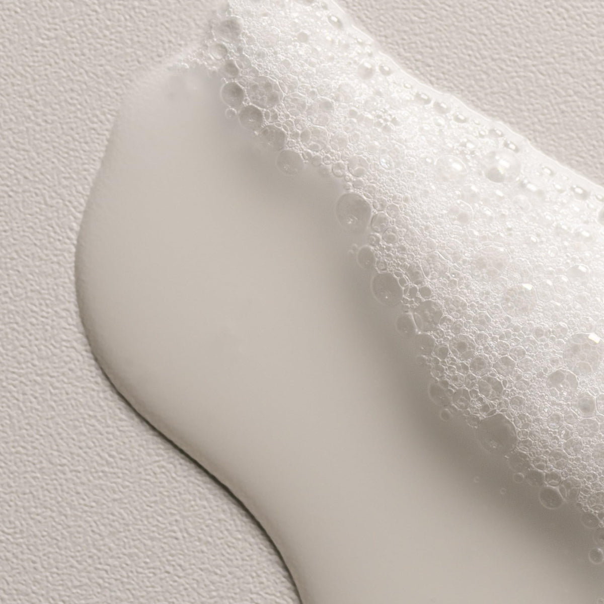 Davines OI Shampoo 330g with a towel and hairbrush