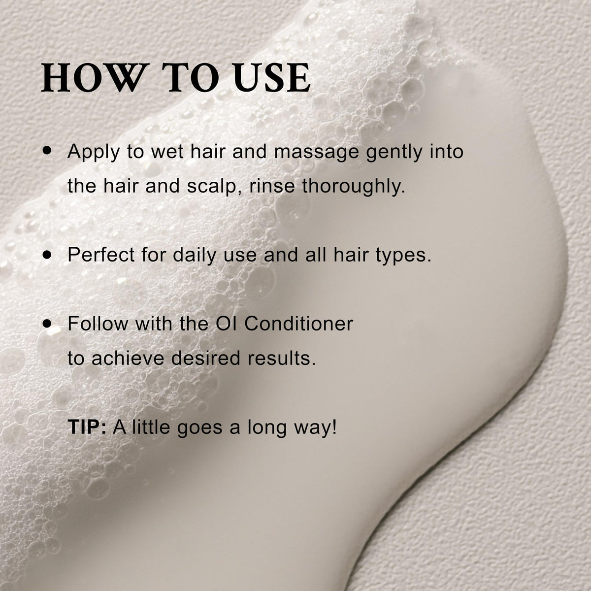 Davines OI Shampoo 549g with a soft lather on hair