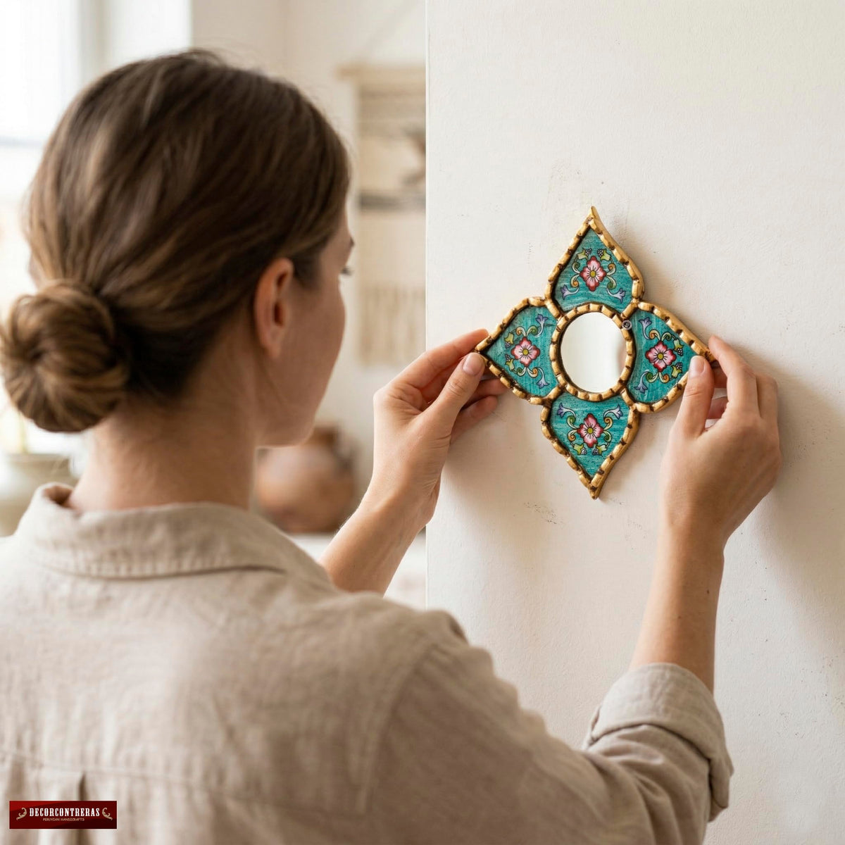 DecorContreras artisan mirror showcasing floral motifs