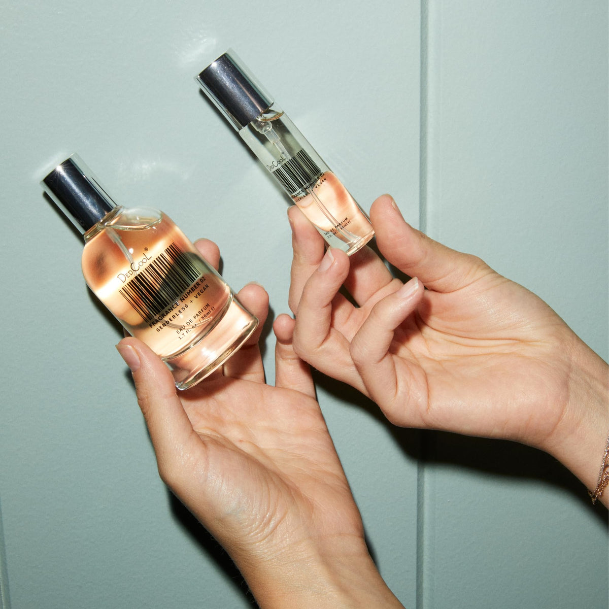 DedCool Eau de Parfum Fragrance 02 travel size next to accessories