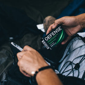 Defense Soap peppermint soap alongside gym gear