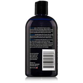 Defense Soap Tea Tree Body Wash on a bathroom shelf