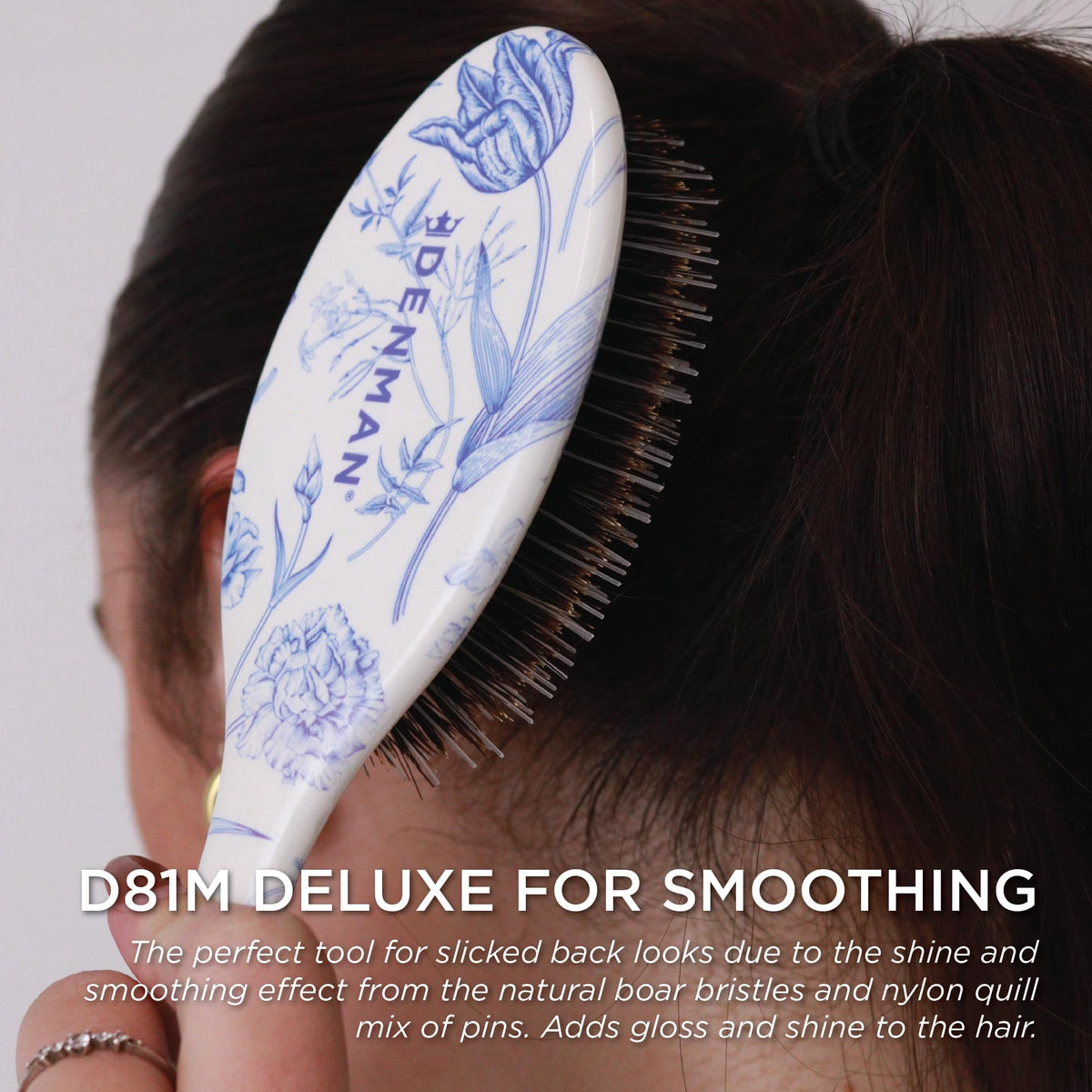 Denman Boar Bristle Hair Brush in hand styling hair