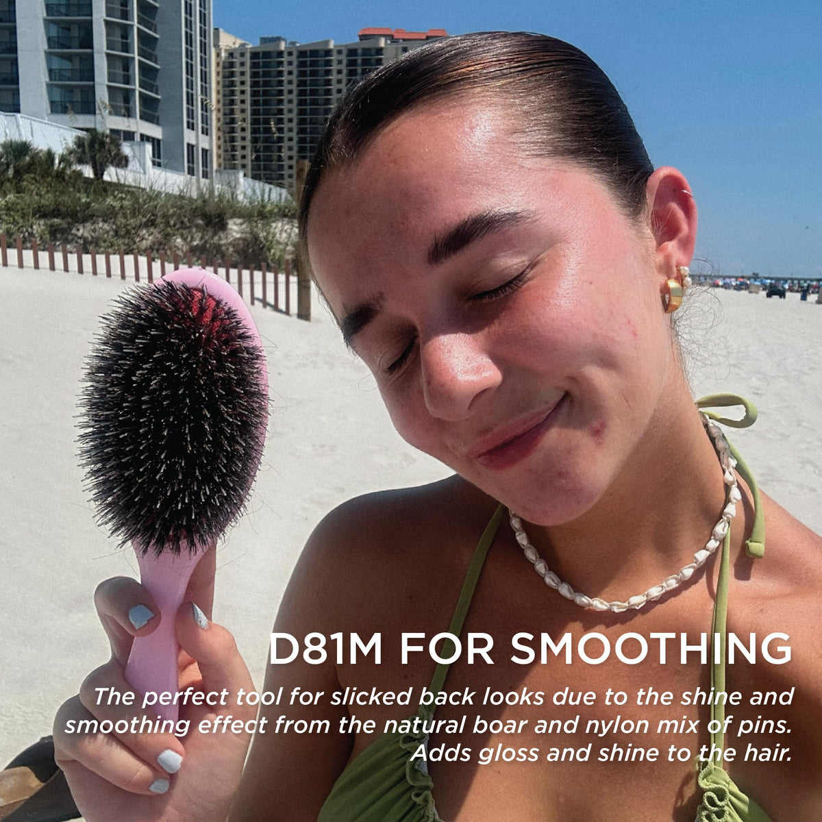 Denman hairbrush demonstrating detangling feature
