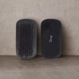 Diane Boar Bristle Brush on a wooden surface