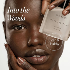 DIME Dans Les Bois Perfume spritzing on wrist