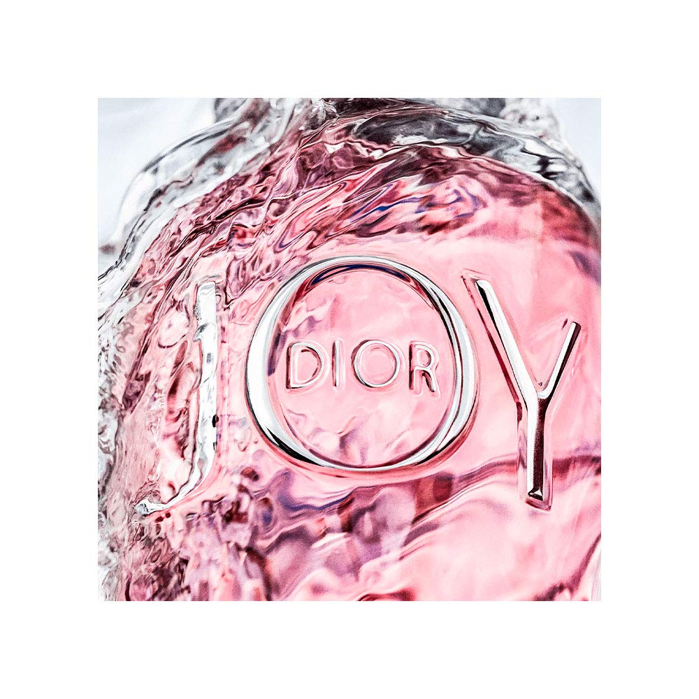 Dior Joy Eau de Parfum 1.7 oz surrounded by flowers