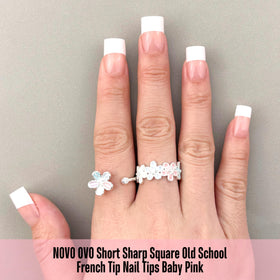 Display of NOVO OVO Baby Pink nail tips in various sizes