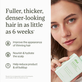 divi Scalp Serum bottle with dropper on a bathroom counter