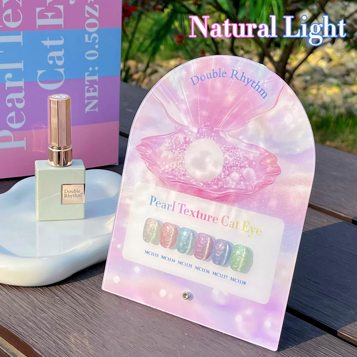 Double Rhythm Cat Eye Gel Nail Polish bottles with UV lamp in background