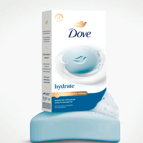 Dove Beauty Bar Soap displayed on a shower shelf