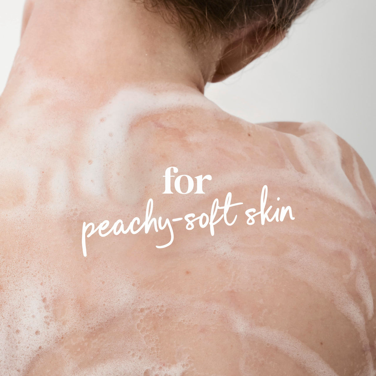 Dove Body Wash Rebalance bottle with soothing peach background