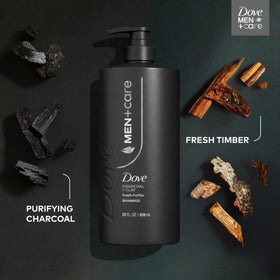 DOVE MEN + CARE Charcoal + Clay 2-in-1 Shampoo on a shower shelf